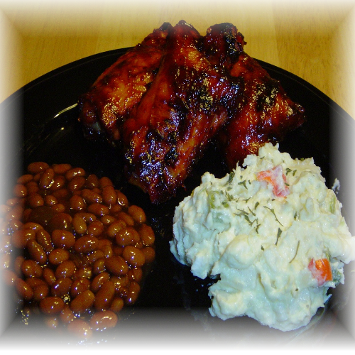 BBQ Chicken with potato salad and baked beans